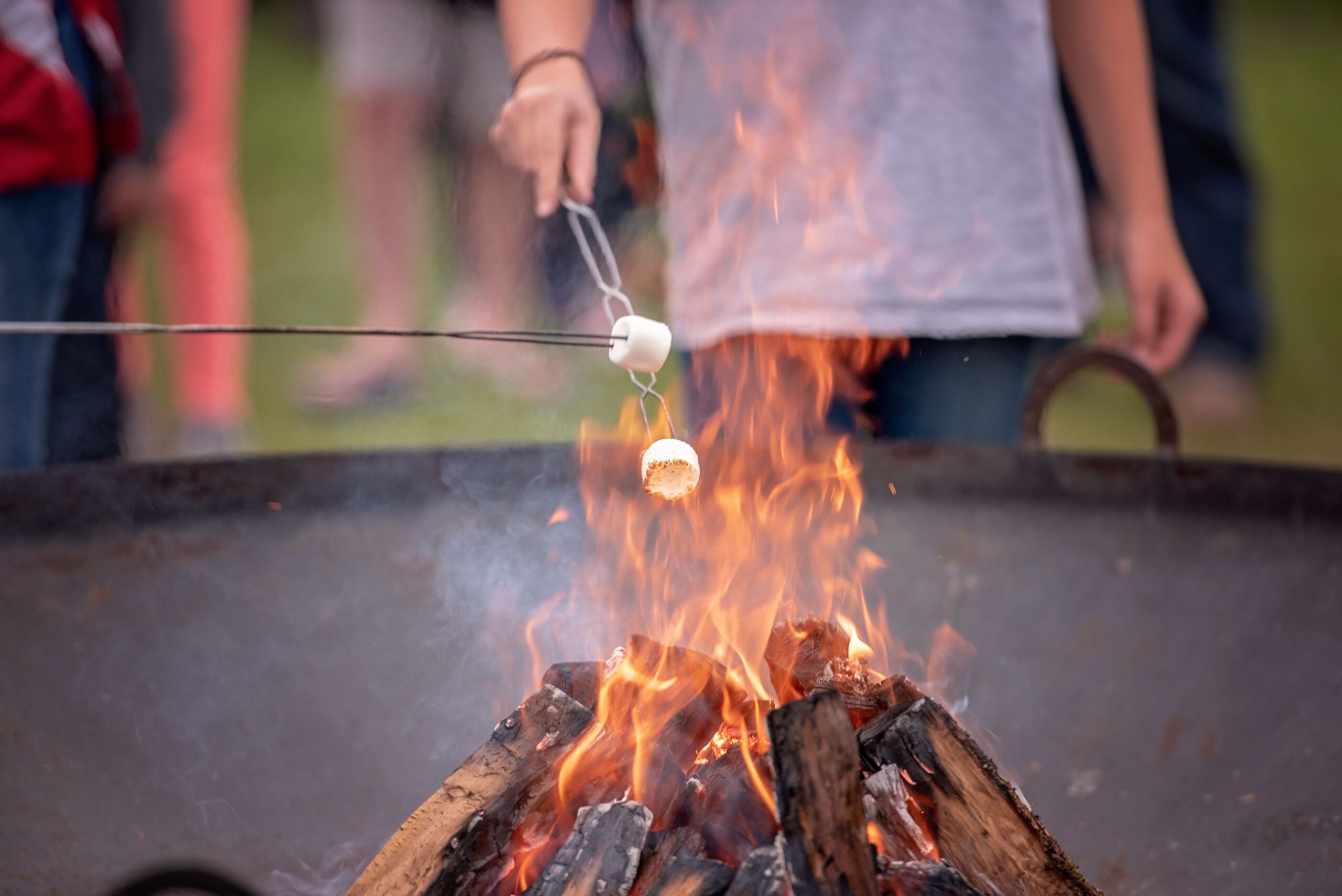 s’more roasting Marshmallows being roasted over a campfire.
